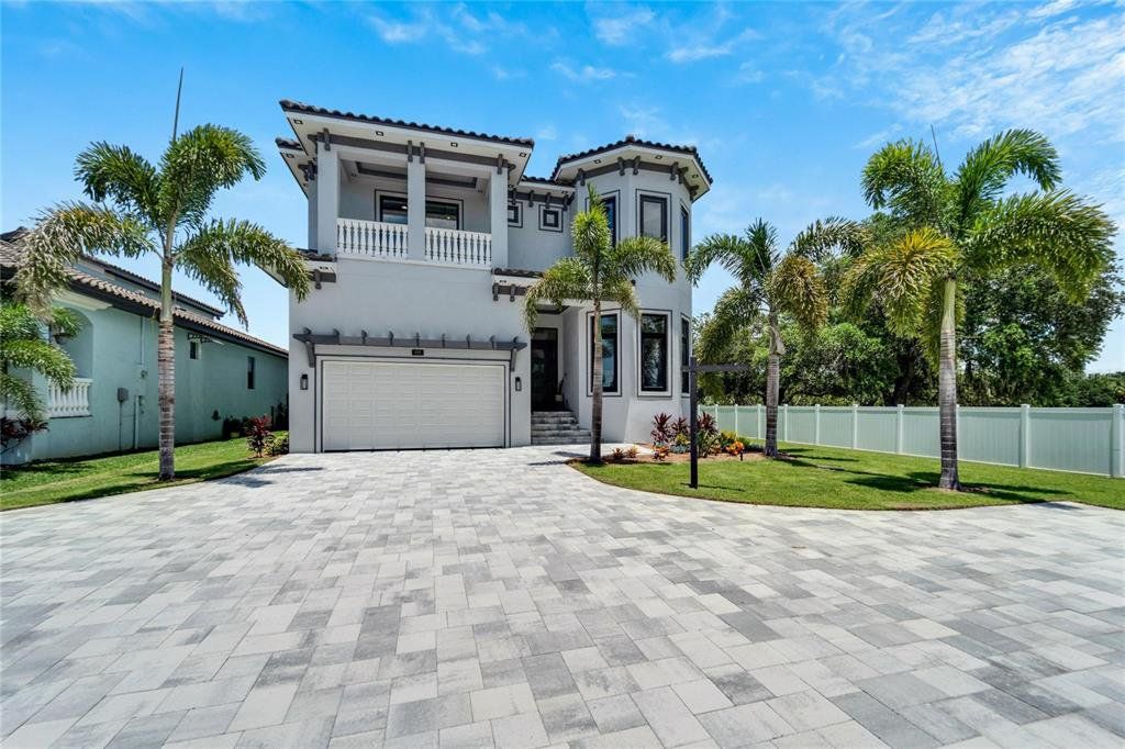Front exterior of a new home in , Apollo Beach, FL, highlighting curb appeal (Image 1). Front exterior of a new home in , Apollo Beach, FL, highlighting curb appeal (Image 1).