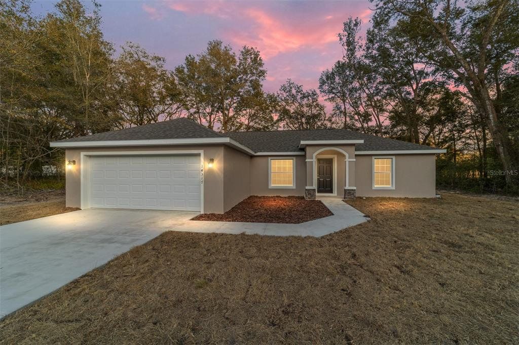 Front exterior of a new home in , Summerfield, FL, highlighting curb appeal (Image 1). Front exterior of a new home in , Summerfield, FL, highlighting curb appeal (Image 1).
