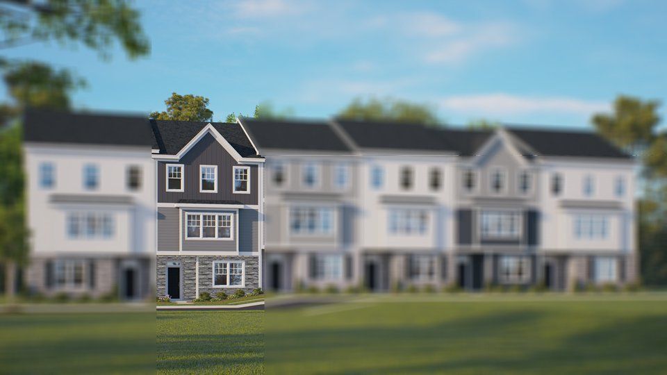 Front exterior of a new home in The Townes at Madden West, Fuquay Varina, NC, highlighting curb appeal (Image 1). Front exterior of a new home in The Townes at Madden West, Fuquay Varina, NC, highlighting curb appeal (Image 1).
