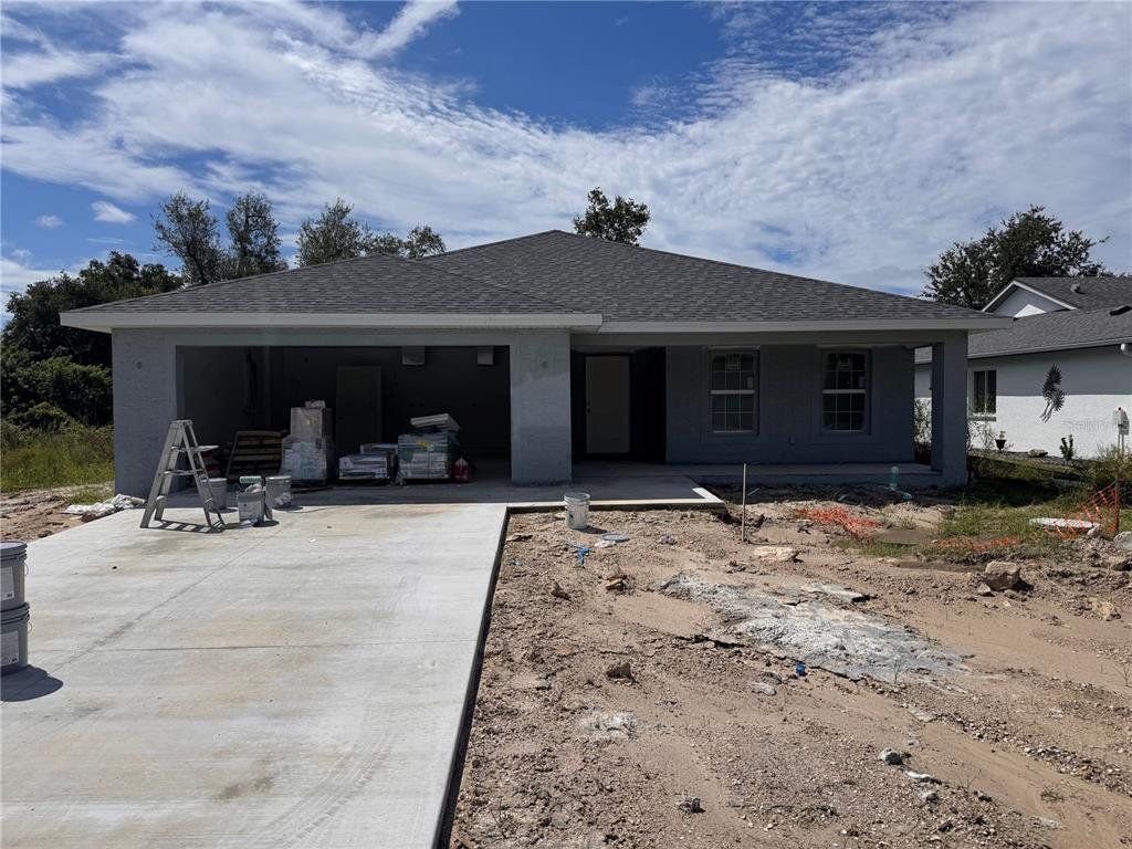Front exterior of a new home in , Rotonda West, FL, highlighting curb appeal (Image 1). Front exterior of a new home in , Rotonda West, FL, highlighting curb appeal (Image 1).
