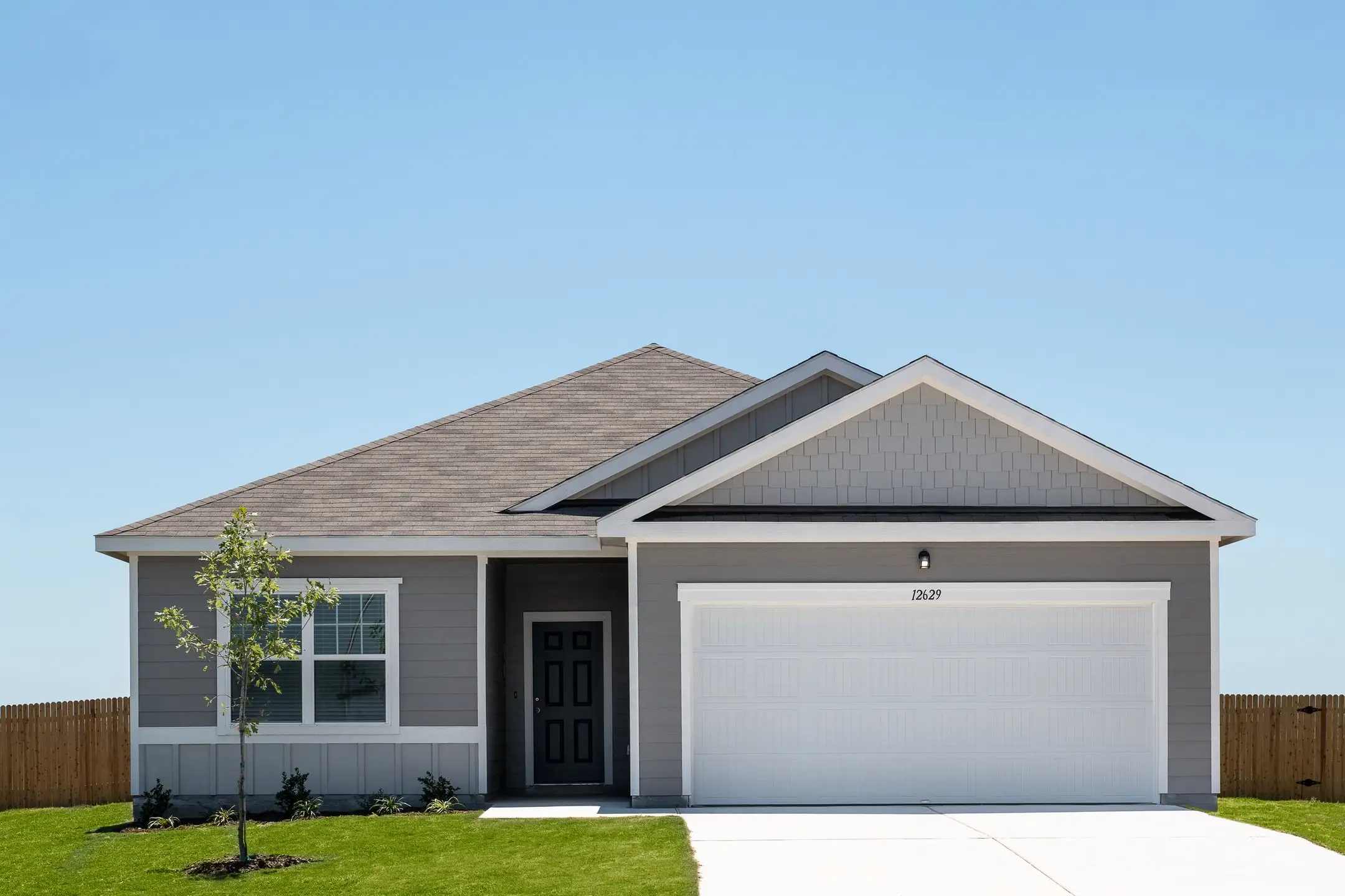 Front exterior of a new home in Cottonwood Creek, San Marcos, TX, highlighting curb appeal (Image 1).
