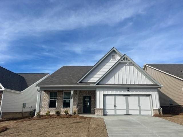 Front exterior of a new home in Cooper's Walk, Loganville, GA, highlighting curb appeal (Image 1).