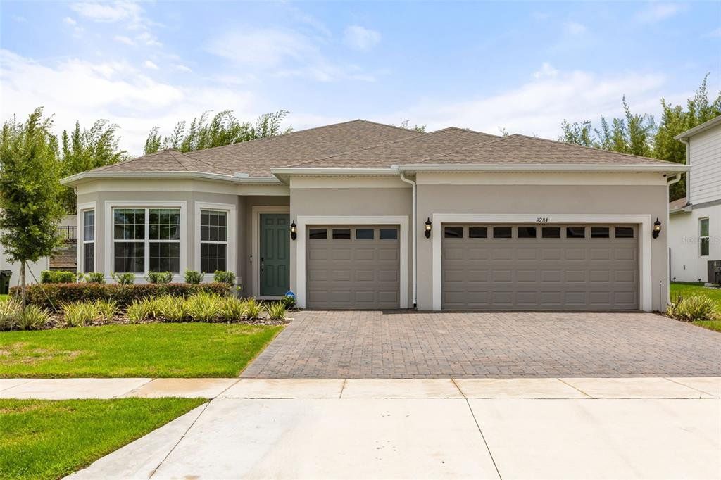 Front exterior of a new home in , Winter Garden, FL, highlighting curb appeal (Image 1). Front exterior of a new home in , Winter Garden, FL, highlighting curb appeal (Image 1).
