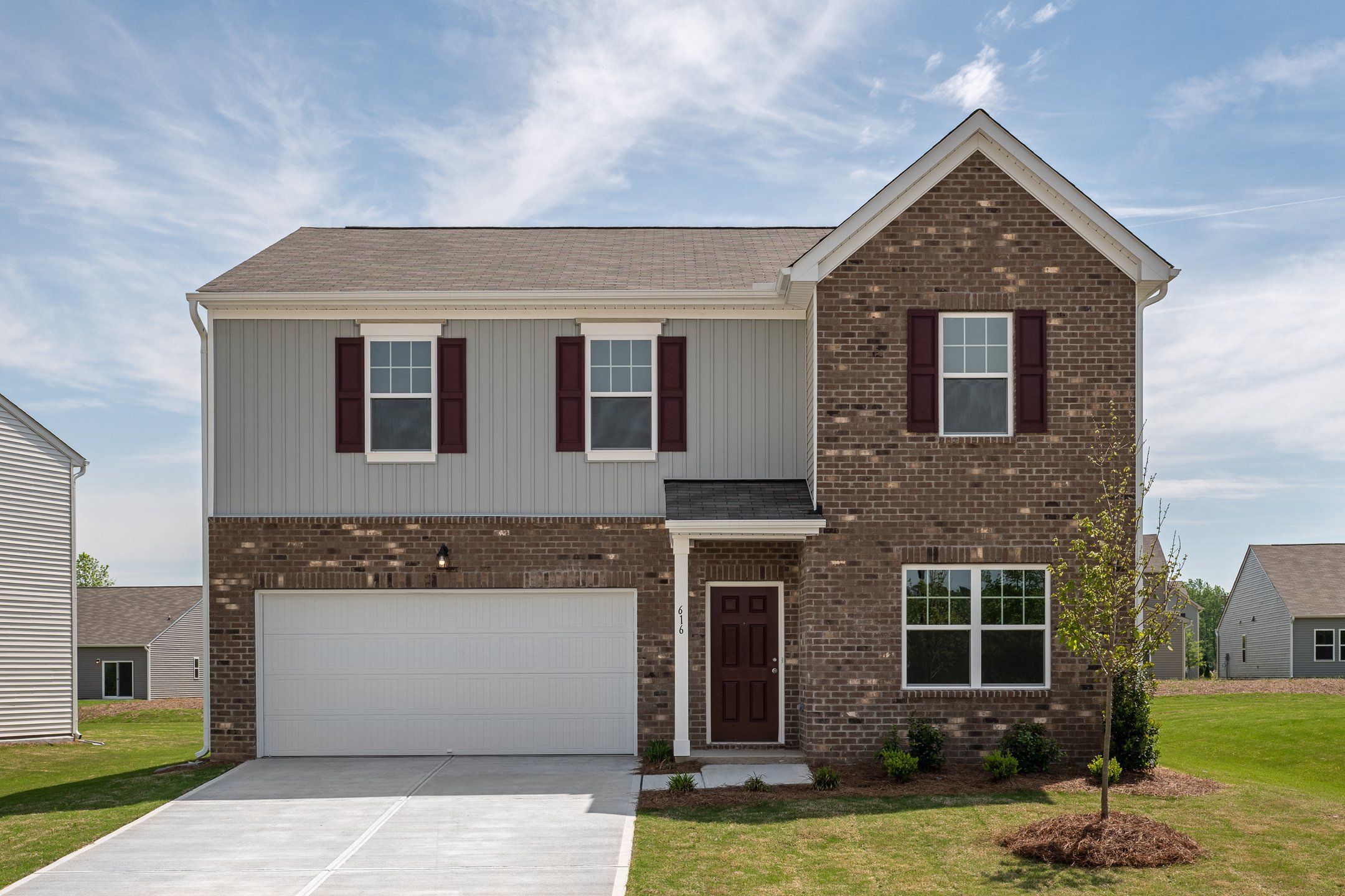 Front exterior of a new home in Silverton, Dacula, GA, highlighting curb appeal (Image 1).