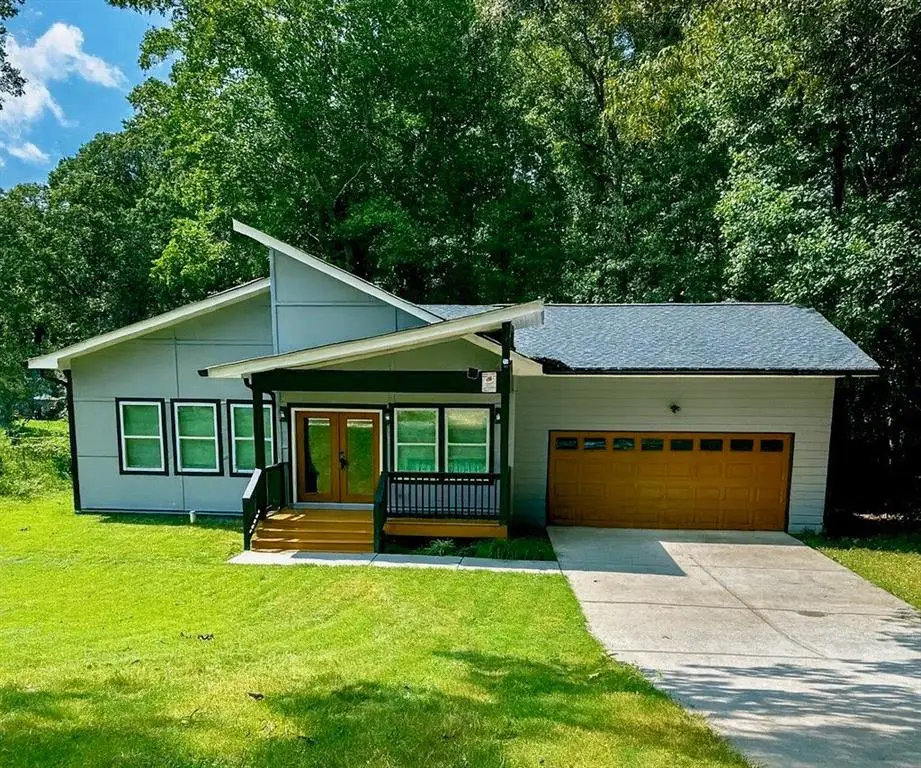 Front exterior of a new home in , Riverdale, GA, highlighting curb appeal (Image 1). Front exterior of a new home in , Riverdale, GA, highlighting curb appeal (Image 1).