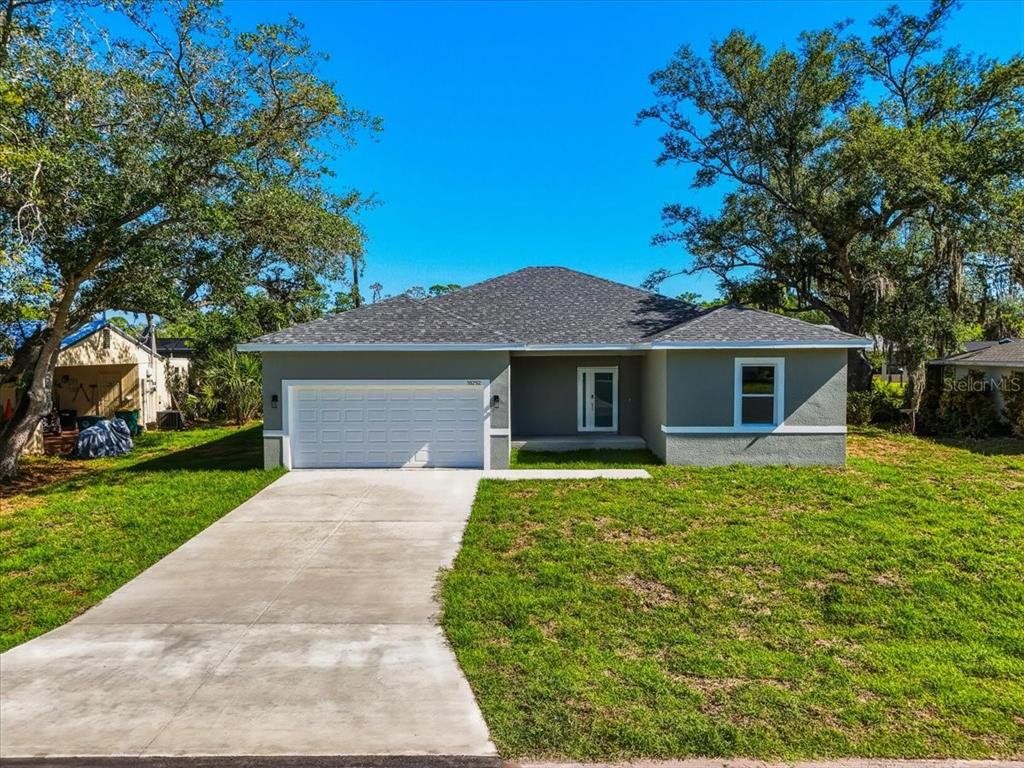 Front exterior of a new home in , Port Charlotte, FL, highlighting curb appeal (Image 1). Front exterior of a new home in , Port Charlotte, FL, highlighting curb appeal (Image 1).