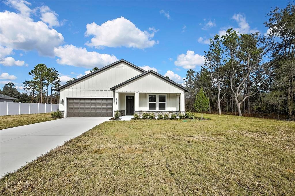 Front exterior of a new home in , Weeki Wachee, FL, highlighting curb appeal (Image 1). Front exterior of a new home in , Weeki Wachee, FL, highlighting curb appeal (Image 1).