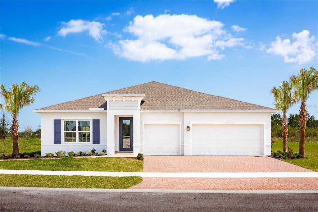 Front exterior of a new home in Ashton Covey, Winter Haven, FL, highlighting curb appeal (Image 1). Front exterior of a new home in Ashton Covey, Winter Haven, FL, highlighting curb appeal (Image 1).