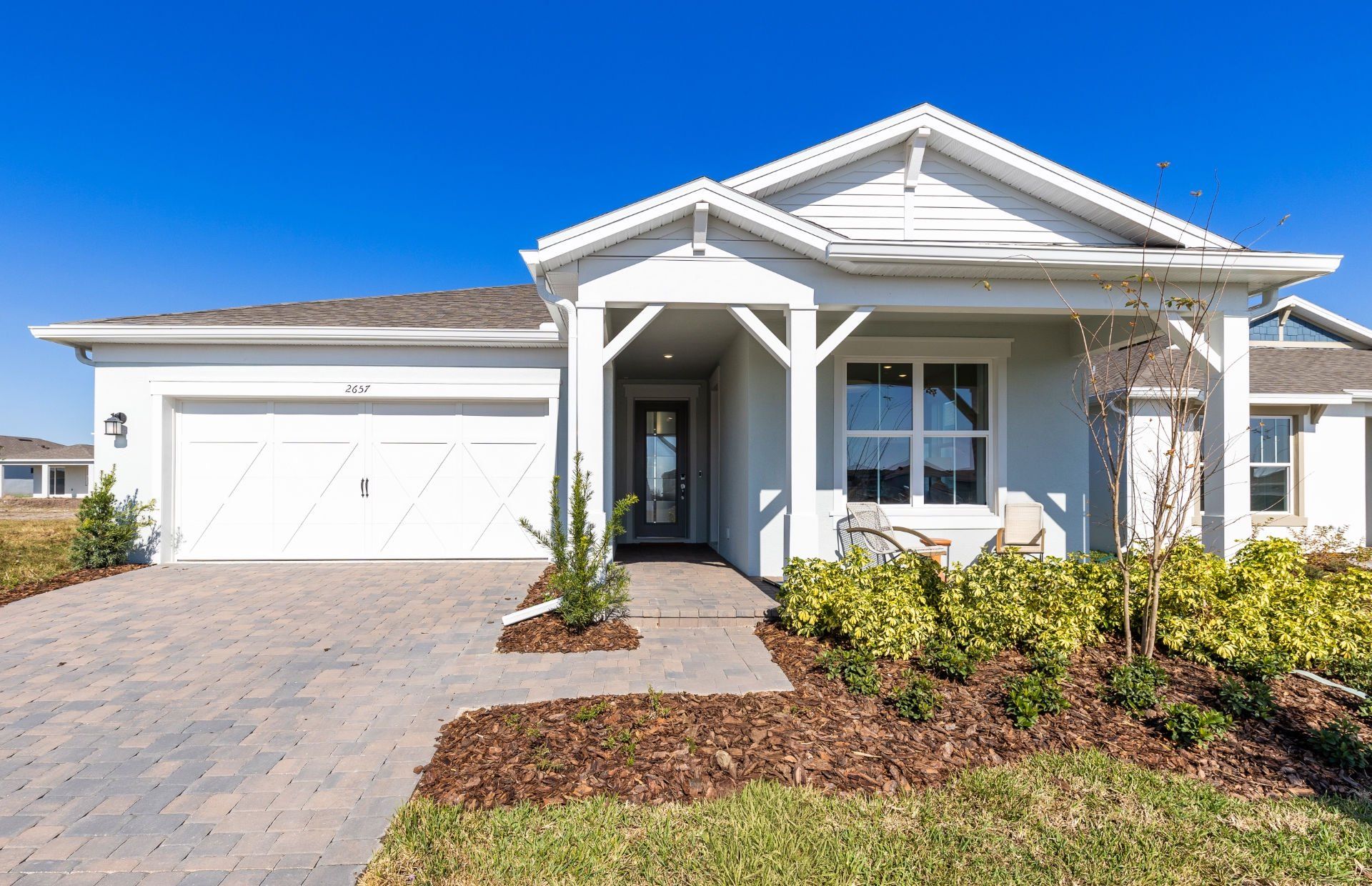 Front exterior of a new home in Tohoqua, Kissimmee, FL, highlighting curb appeal (Image 1). Front exterior of a new home in Tohoqua, Kissimmee, FL, highlighting curb appeal (Image 1).