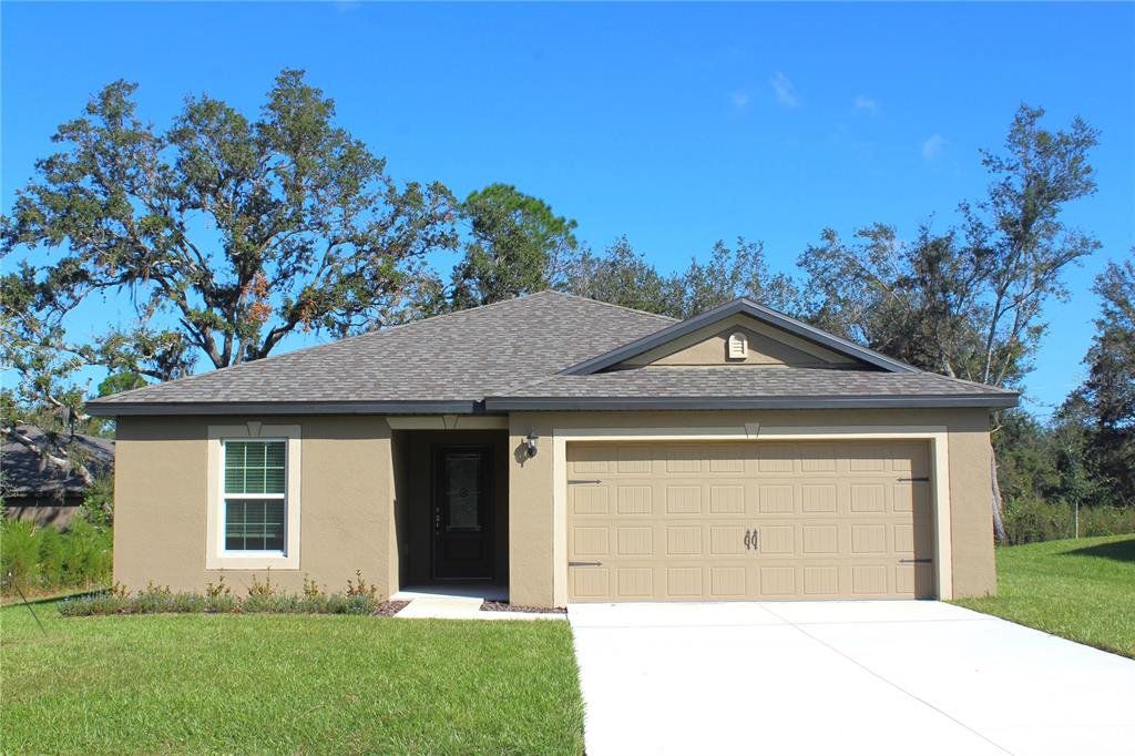 Front exterior of a new home in Poinciana, Poinciana, FL, highlighting curb appeal (Image 1). Front exterior of a new home in Poinciana, Poinciana, FL, highlighting curb appeal (Image 1).