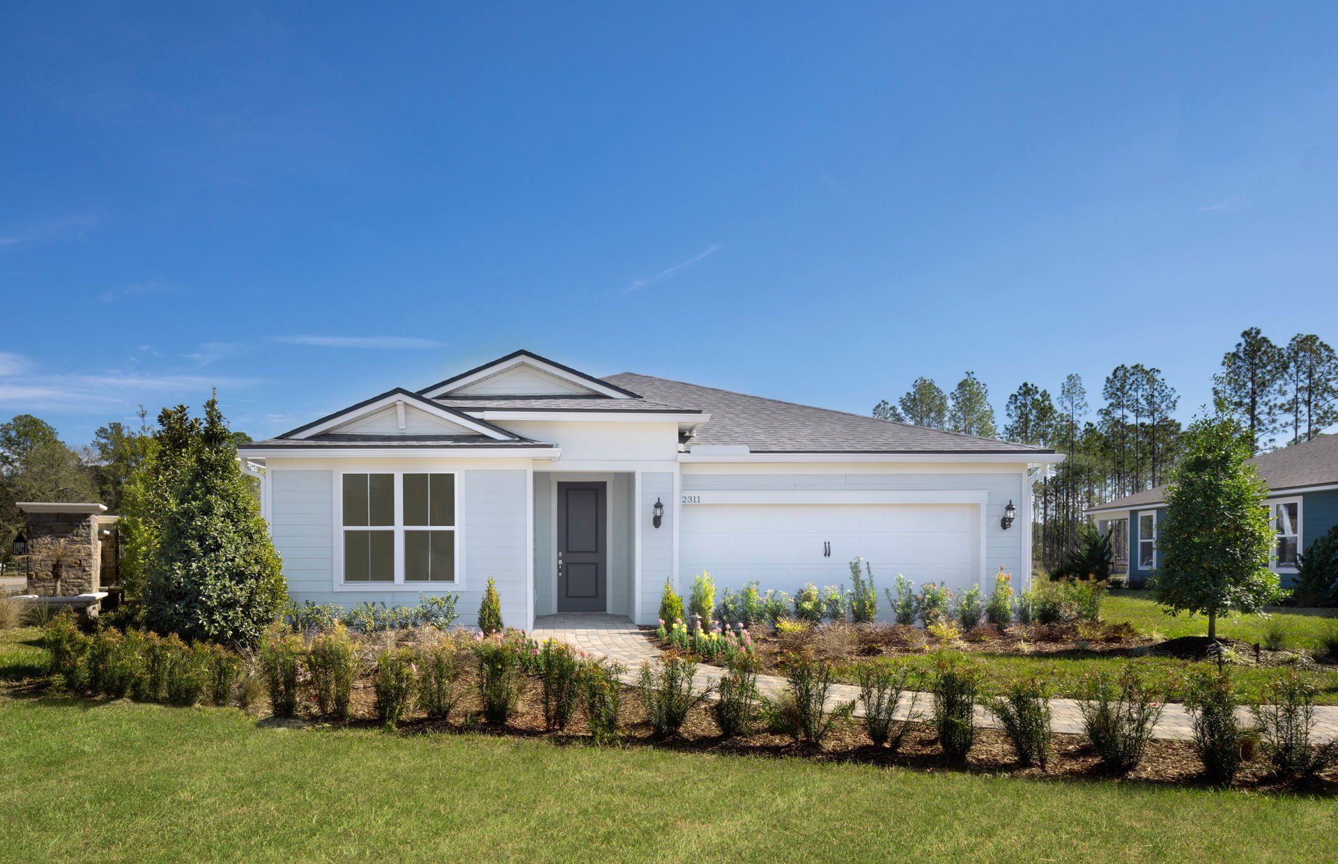 Front exterior of a new home in Murray Farms, Middleburg, FL, highlighting curb appeal (Image 1). Front exterior of a new home in Murray Farms, Middleburg, FL, highlighting curb appeal (Image 1).