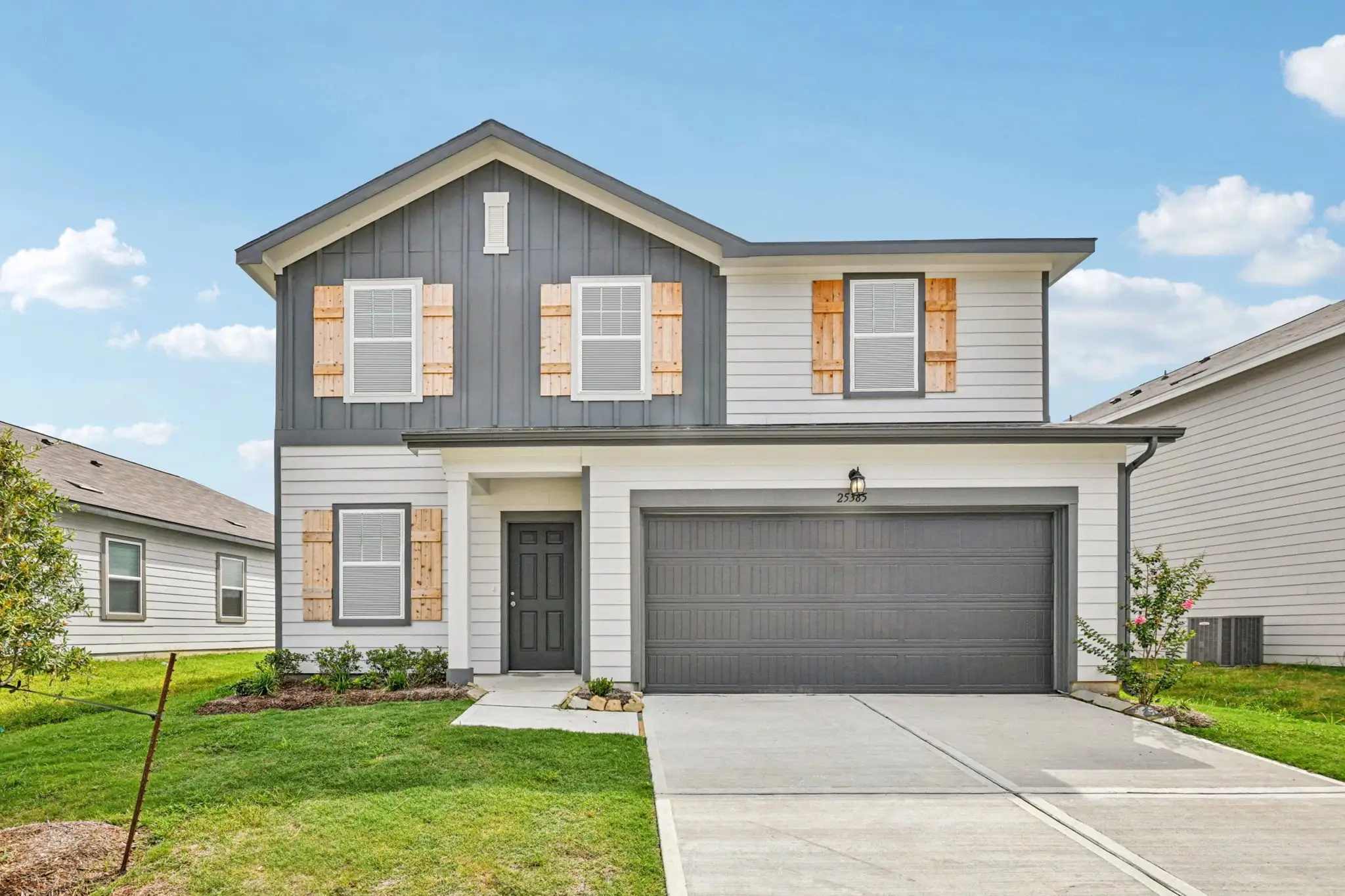 Front exterior of a new home in Rolling Glen, Hutto, TX, highlighting curb appeal (Image 1).