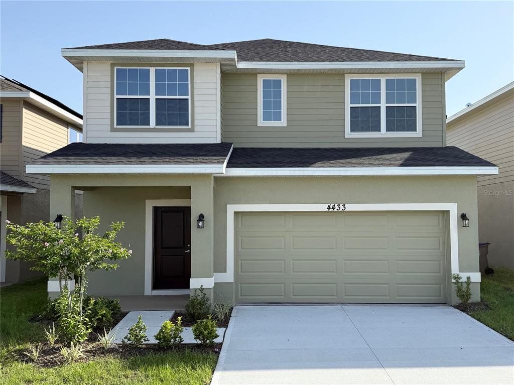 Front exterior of a new home in Harmony Central, St. Cloud, FL, highlighting curb appeal (Image 1). Front exterior of a new home in Harmony Central, St. Cloud, FL, highlighting curb appeal (Image 1).