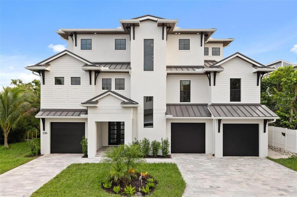 Front exterior of a new home in , Sarasota, FL, highlighting curb appeal (Image 1). Front exterior of a new home in , Sarasota, FL, highlighting curb appeal (Image 1).