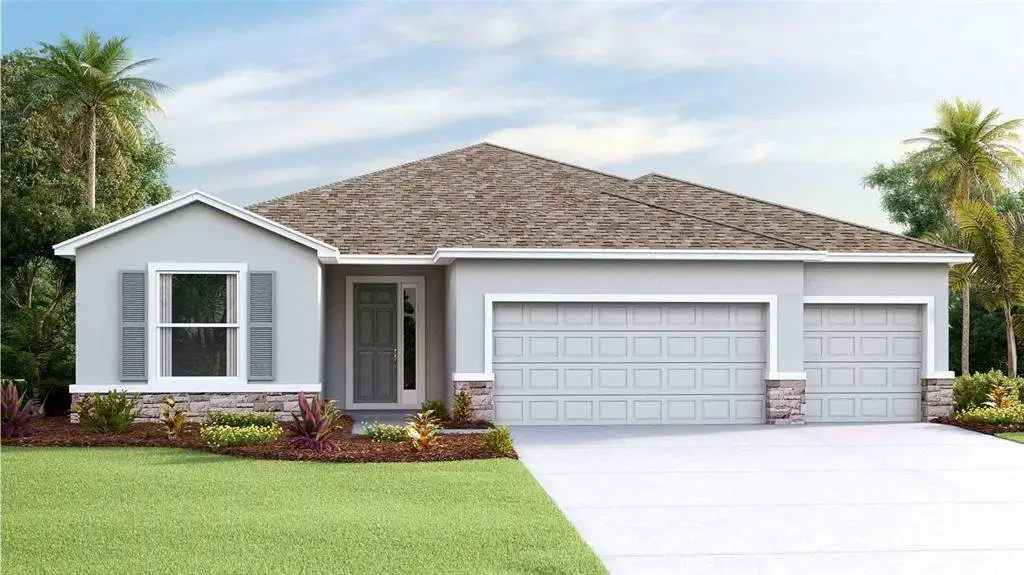Front exterior of a new home in Woodcreek, Wesley Chapel, FL, highlighting curb appeal (Image 1). Front exterior of a new home in Woodcreek, Wesley Chapel, FL, highlighting curb appeal (Image 1).