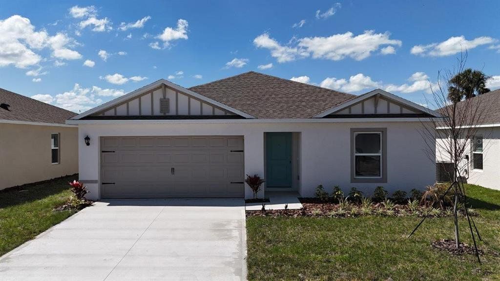Front exterior of a new home in Leomas Landing, Lake Wales, FL, highlighting curb appeal (Image 1). Front exterior of a new home in Leomas Landing, Lake Wales, FL, highlighting curb appeal (Image 1).