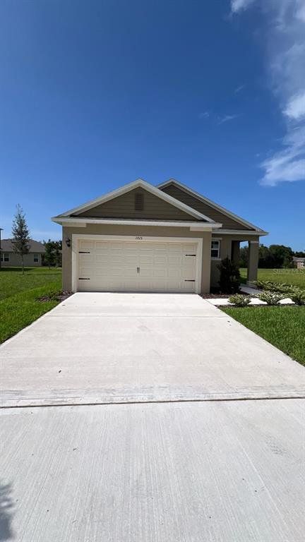 Front exterior of a new home in Harmony West, St. Cloud, FL, highlighting curb appeal (Image 1).