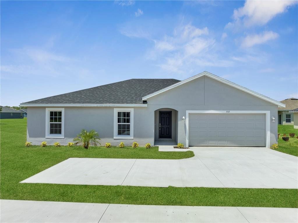 Front exterior of a new home in , Kissimmee, FL, highlighting curb appeal (Image 1). Front exterior of a new home in , Kissimmee, FL, highlighting curb appeal (Image 1).