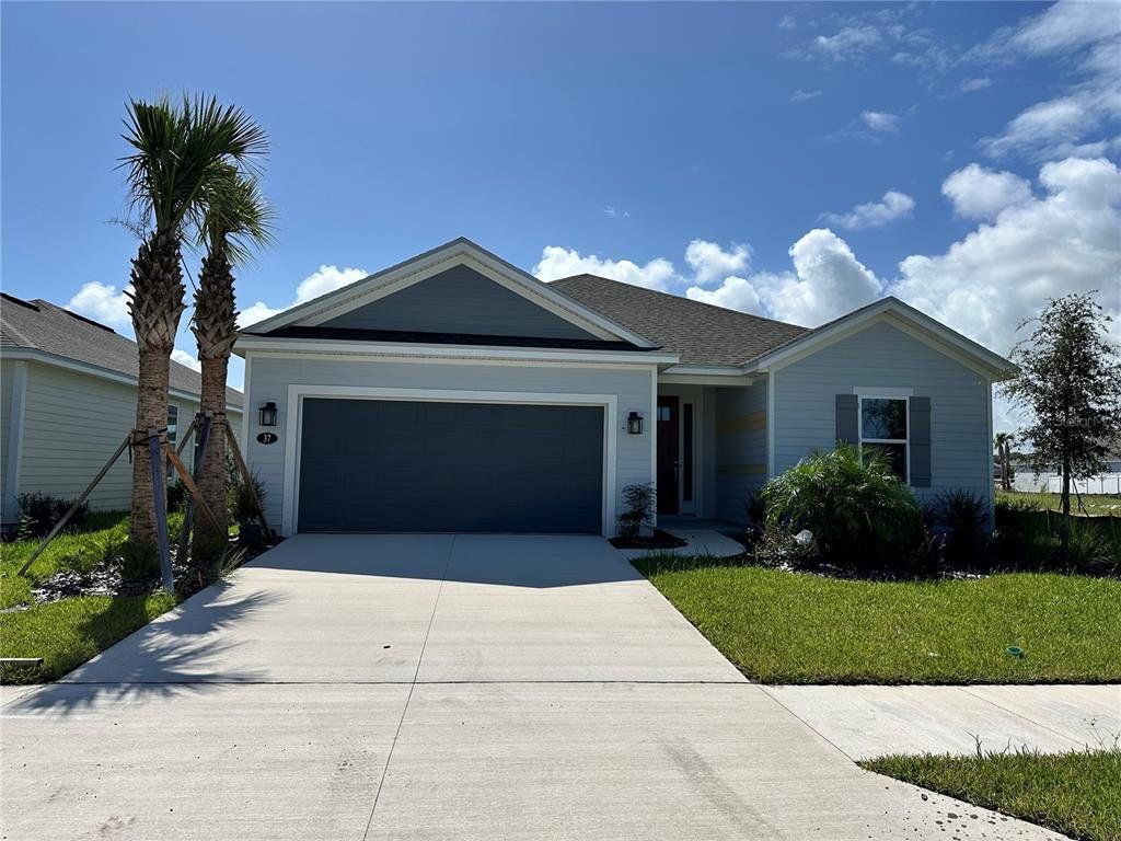Front exterior of a new home in Colbert Landings, Palm Coast, FL, highlighting curb appeal (Image 1). Front exterior of a new home in Colbert Landings, Palm Coast, FL, highlighting curb appeal (Image 1).