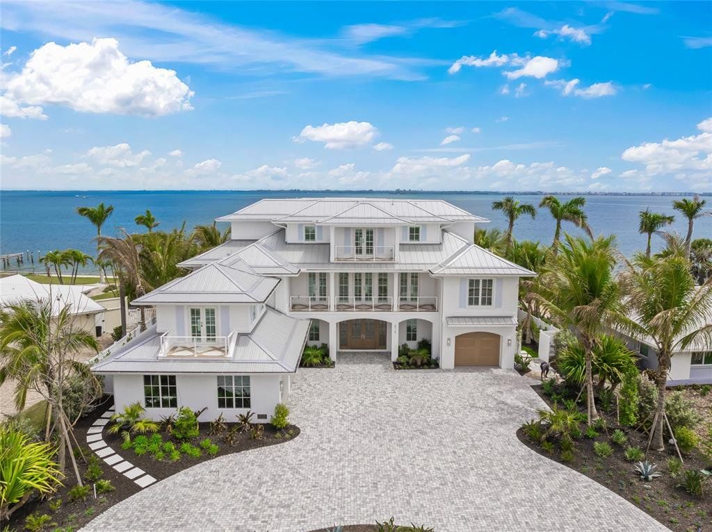 Front exterior of a new home in , Holmes Beach, FL, highlighting curb appeal (Image 1). Front exterior of a new home in , Holmes Beach, FL, highlighting curb appeal (Image 1).
