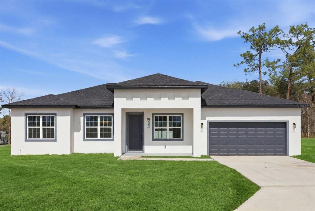 Front exterior of a new home in , Ocala, FL, highlighting curb appeal (Image 1). Front exterior of a new home in , Ocala, FL, highlighting curb appeal (Image 1).