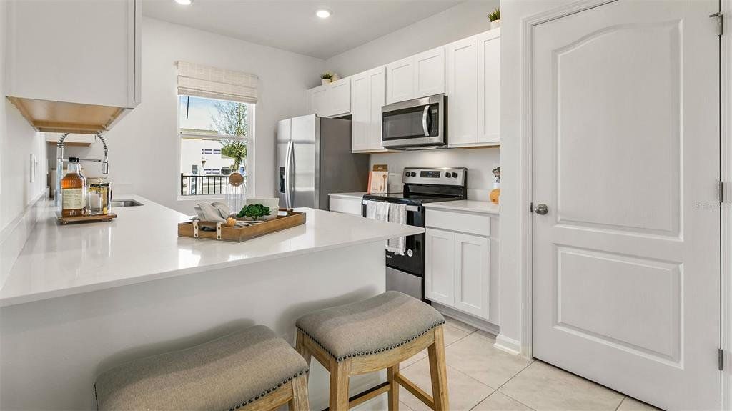 Furnished interior view inside a new home in Cordera Townhomes, St. Augustine (Image 1). Furnished interior view inside a new home in Cordera Townhomes, St. Augustine (Image 1).