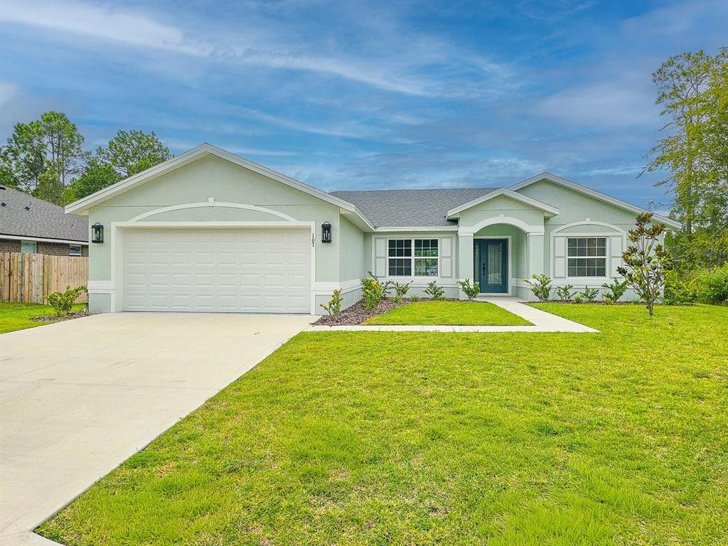 Front exterior of a new home in , Palm Coast, FL, highlighting curb appeal (Image 1). Front exterior of a new home in , Palm Coast, FL, highlighting curb appeal (Image 1).