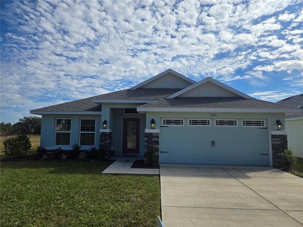 Front exterior of a new home in Wyld Palms, Inverness, FL, highlighting curb appeal (Image 1). Front exterior of a new home in Wyld Palms, Inverness, FL, highlighting curb appeal (Image 1).