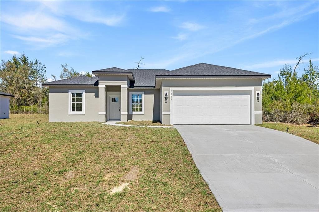 Front exterior of a new home in , Ocala, FL, highlighting curb appeal (Image 1). Front exterior of a new home in , Ocala, FL, highlighting curb appeal (Image 1).