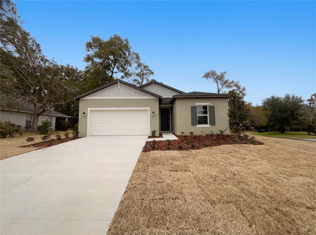 Front exterior of a new home in Grand Park, Dunnellon, FL, highlighting curb appeal (Image 1). Front exterior of a new home in Grand Park, Dunnellon, FL, highlighting curb appeal (Image 1).