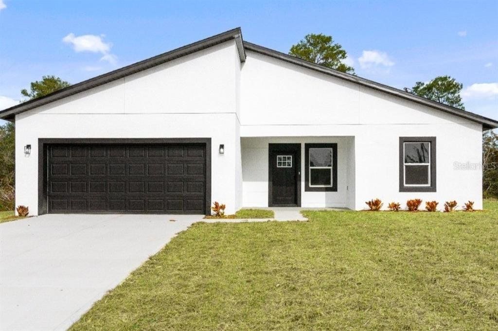 Front exterior of a new home in , Ocala, FL, highlighting curb appeal (Image 1). Front exterior of a new home in , Ocala, FL, highlighting curb appeal (Image 1).