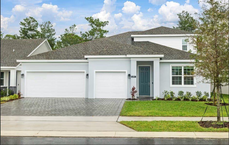 Front exterior of a new home in Trinity Gardens, Deland, FL, highlighting curb appeal (Image 1). Front exterior of a new home in Trinity Gardens, Deland, FL, highlighting curb appeal (Image 1).
