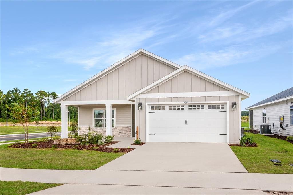 Front exterior of a new home in , Newberry, FL, highlighting curb appeal (Image 1). Front exterior of a new home in , Newberry, FL, highlighting curb appeal (Image 1).
