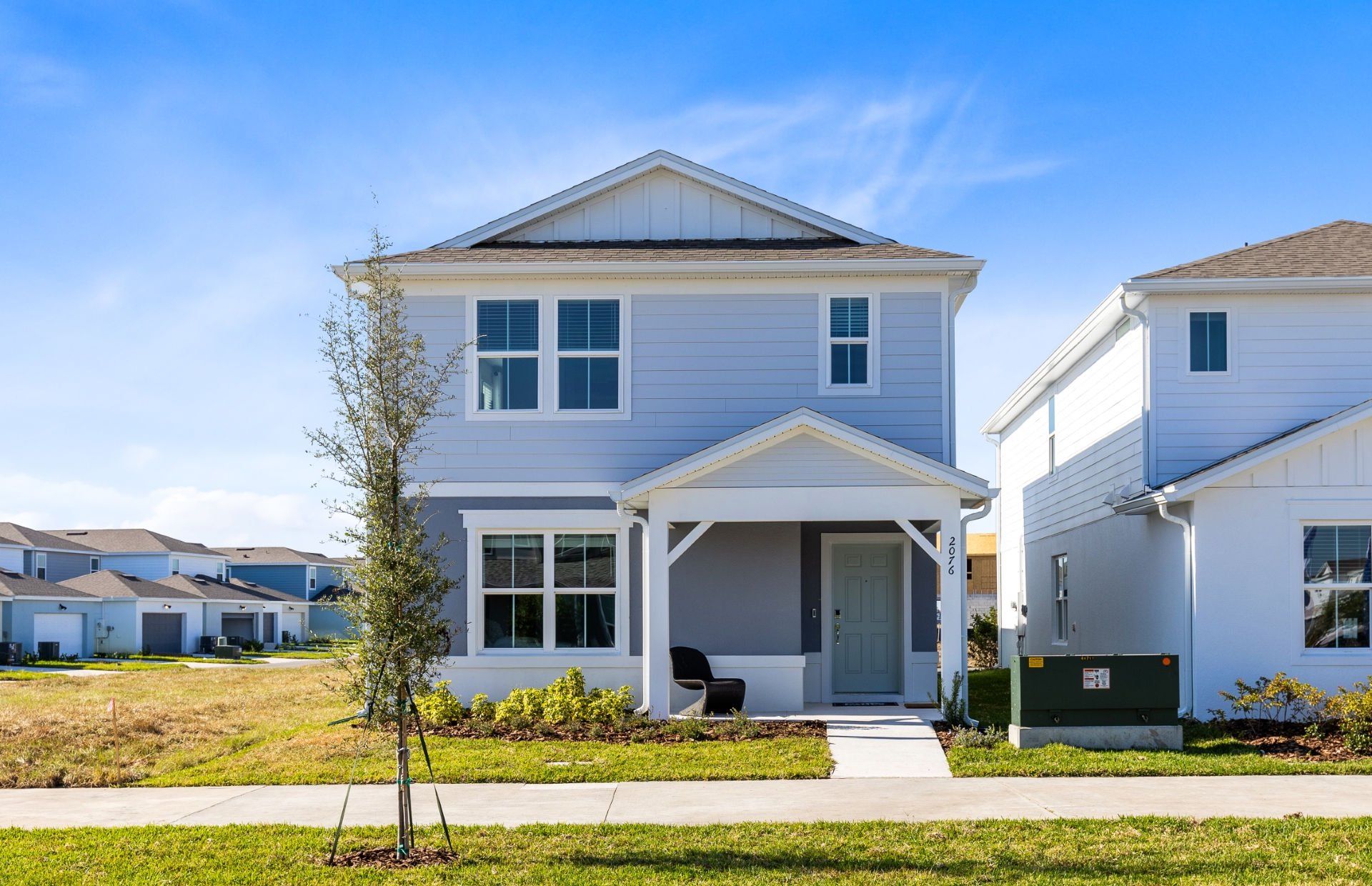 Front exterior of a new home in Tohoqua, Kissimmee, FL, highlighting curb appeal (Image 1). Front exterior of a new home in Tohoqua, Kissimmee, FL, highlighting curb appeal (Image 1).