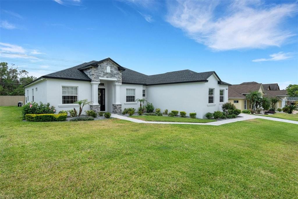 Front exterior of a new home in , Lakeland, FL, highlighting curb appeal (Image 1). Front exterior of a new home in , Lakeland, FL, highlighting curb appeal (Image 1).