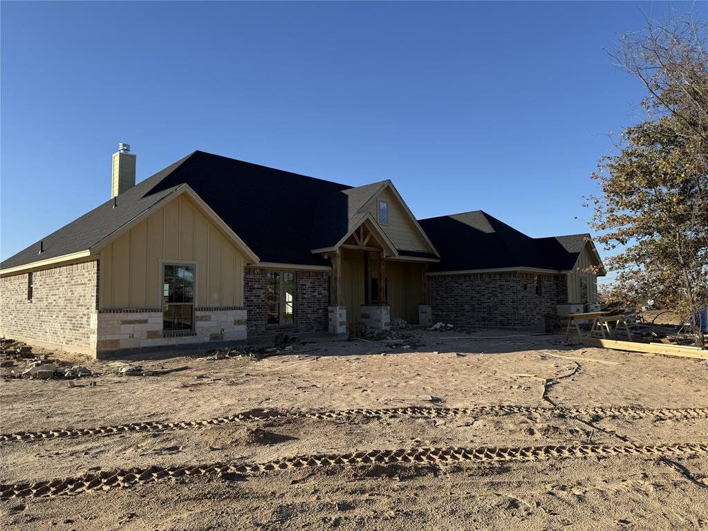 In-progress construction of a new home in , Poolville, TX (Image 1).