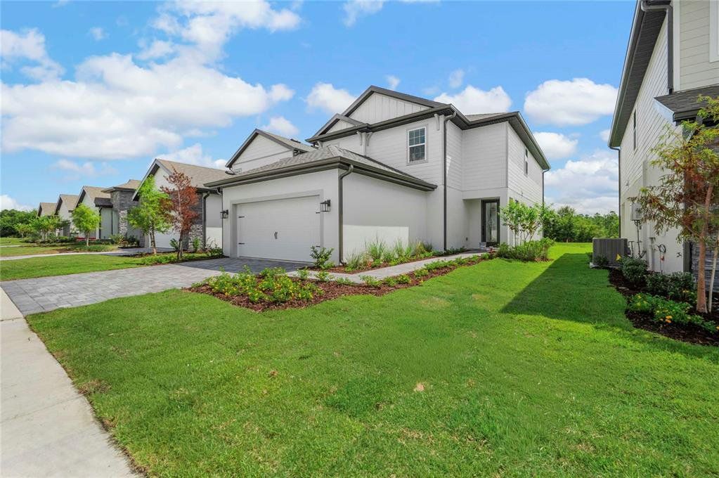 Front exterior of a new home in , Kissimmee, FL, highlighting curb appeal (Image 1). Front exterior of a new home in , Kissimmee, FL, highlighting curb appeal (Image 1).