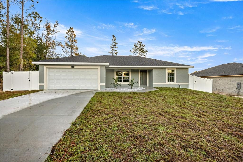 Front exterior of a new home in , Ocala, FL, highlighting curb appeal (Image 1).