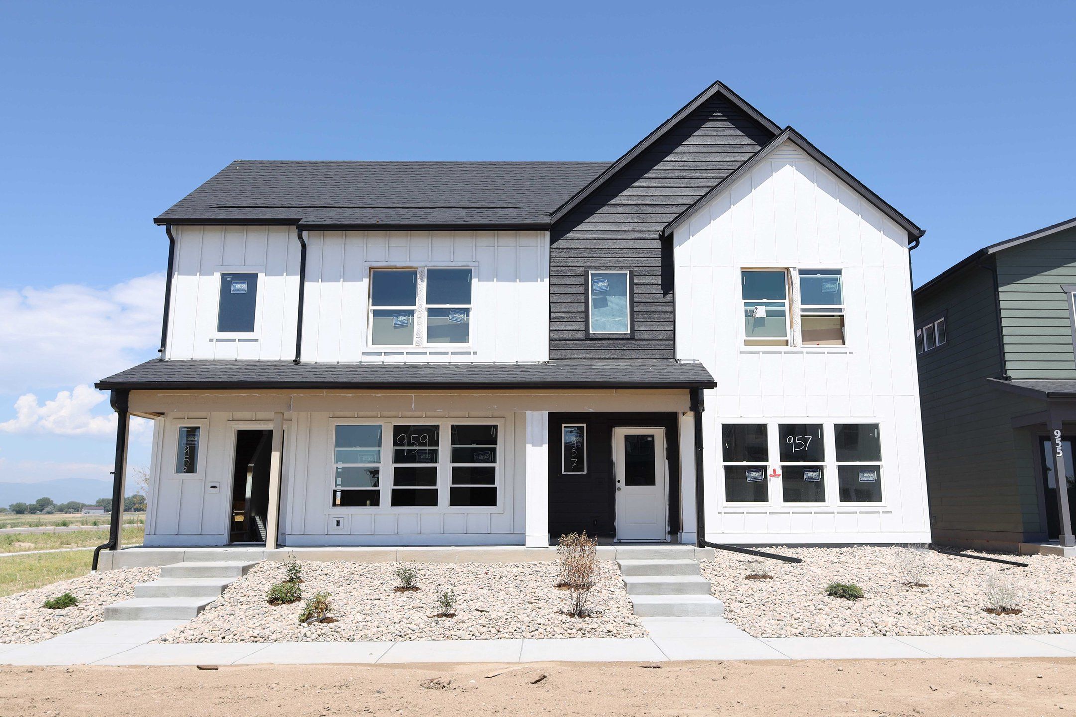 Front exterior of a new home in Prairie Song, Windsor, CO, highlighting curb appeal (Image 1). Front exterior of a new home in Prairie Song, Windsor, CO, highlighting curb appeal (Image 1).