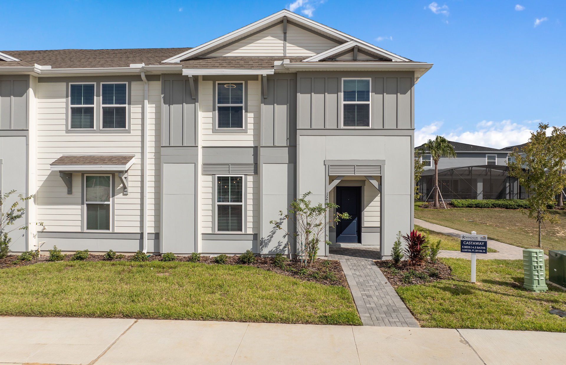 Front exterior of a new home in Windsor Cay Resort, Clermont, FL, highlighting curb appeal (Image 1). Front exterior of a new home in Windsor Cay Resort, Clermont, FL, highlighting curb appeal (Image 1).