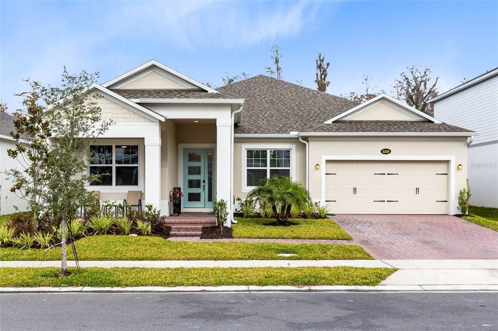 Front exterior of a new home in Eden at Crossprairie, St. Cloud, FL, highlighting curb appeal (Image 1). Front exterior of a new home in Eden at Crossprairie, St. Cloud, FL, highlighting curb appeal (Image 1).