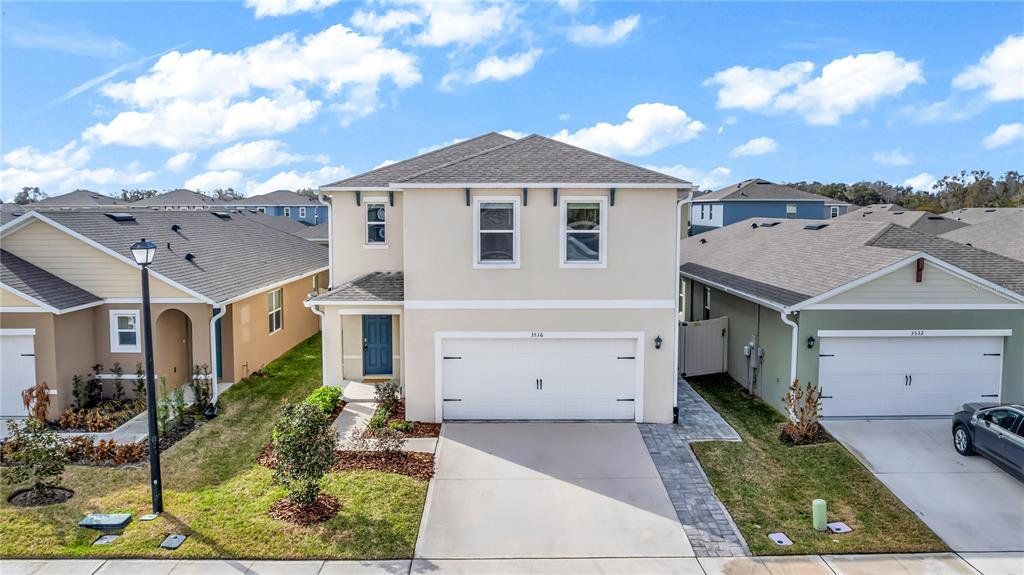 Front exterior of a new home in Eastgrove, Sanford, FL, highlighting curb appeal (Image 1). Front exterior of a new home in Eastgrove, Sanford, FL, highlighting curb appeal (Image 1).