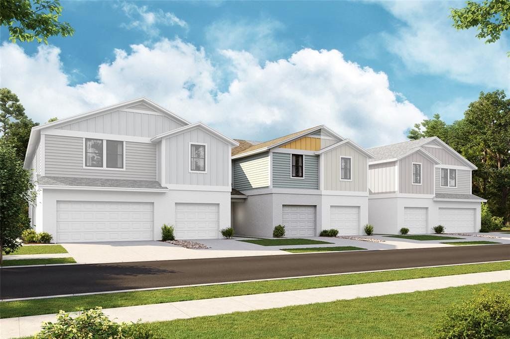 Front exterior of a new home in Grove at Crosswinds, Haines City, FL, highlighting curb appeal (Image 1). Front exterior of a new home in Grove at Crosswinds, Haines City, FL, highlighting curb appeal (Image 1).