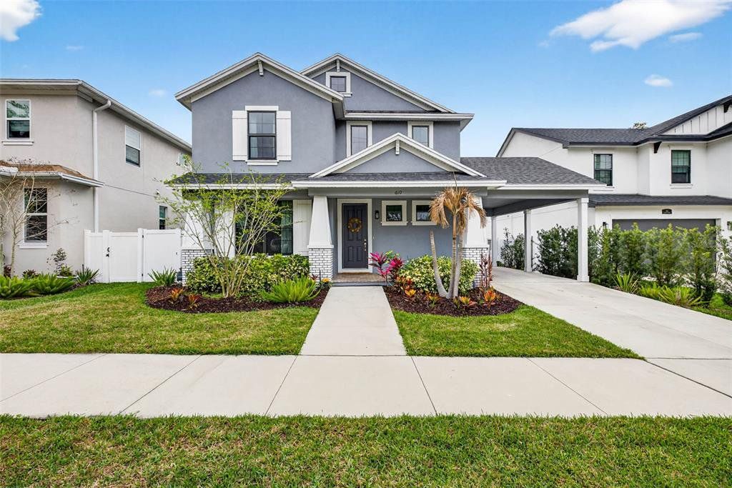 Front exterior of a new home in Clearfield Crossings, Tampa, FL, highlighting curb appeal (Image 1). Front exterior of a new home in Clearfield Crossings, Tampa, FL, highlighting curb appeal (Image 1).