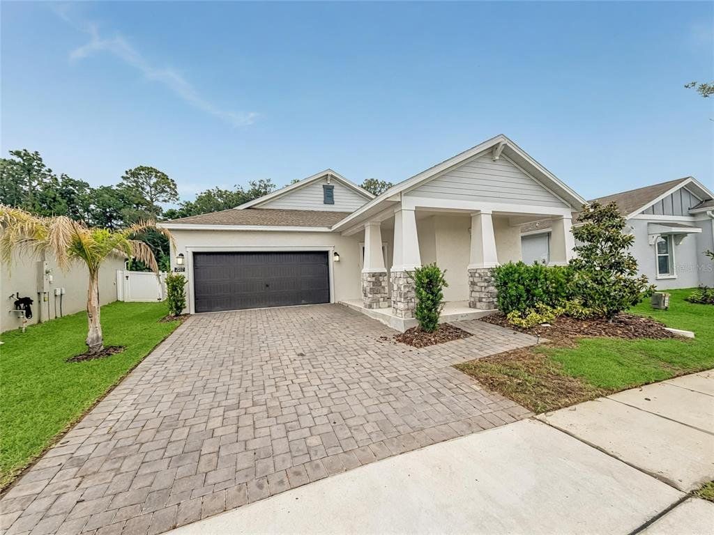 Front exterior of a new home in , Kissimmee, FL, highlighting curb appeal (Image 1). Front exterior of a new home in , Kissimmee, FL, highlighting curb appeal (Image 1).