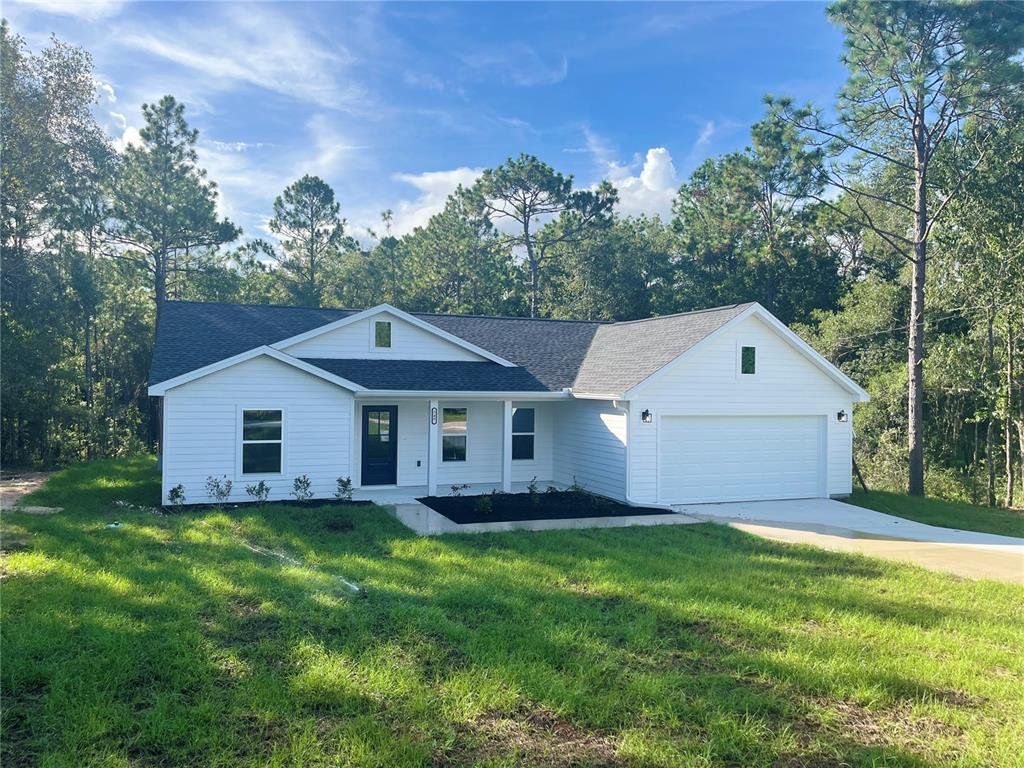 Front exterior of a new home in , Williston, FL, highlighting curb appeal (Image 1).