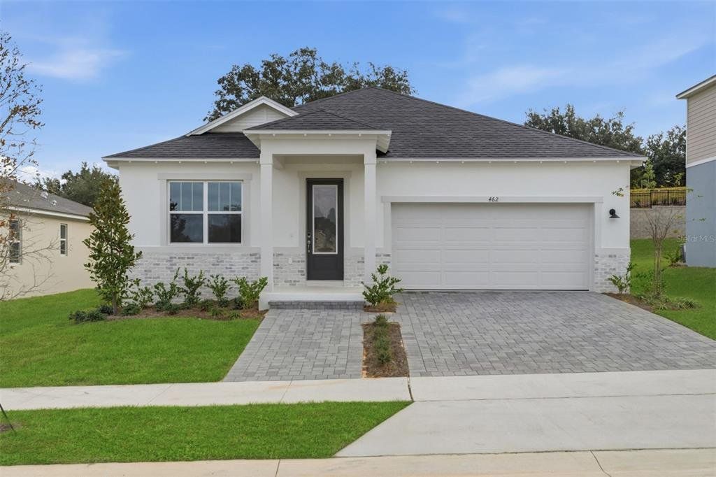 Front exterior of a new home in Rainwood, Clermont, FL, highlighting curb appeal (Image 1). Front exterior of a new home in Rainwood, Clermont, FL, highlighting curb appeal (Image 1).