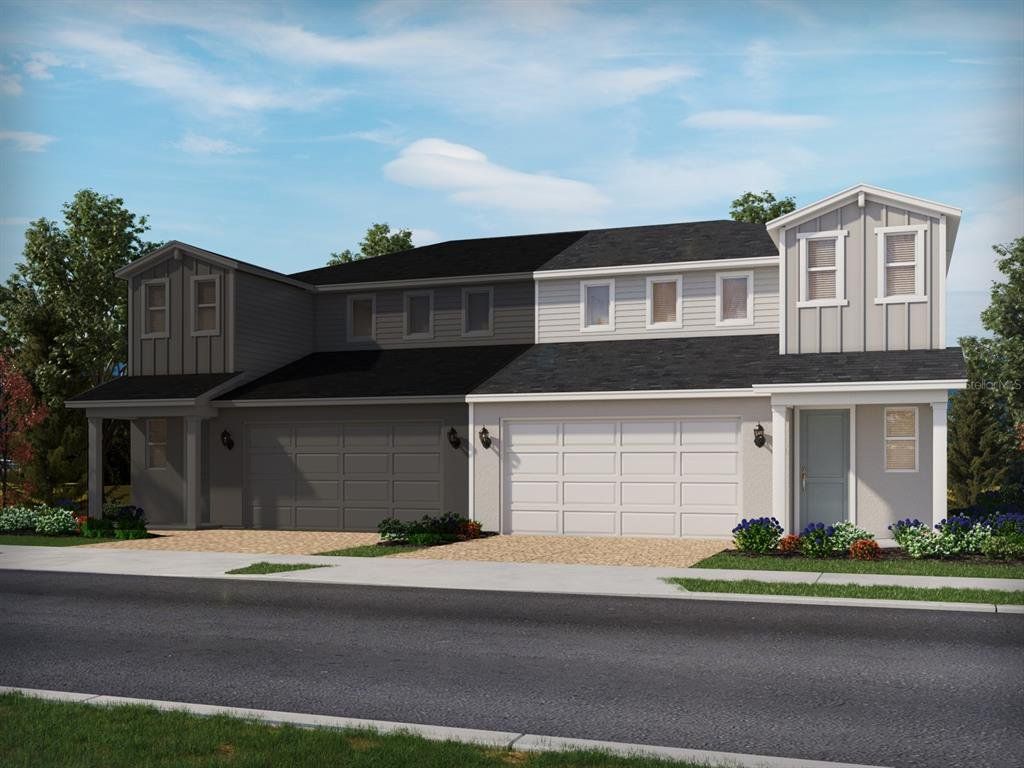 Front exterior of a new home in Cyrene at Minneola - Villas, Montverde, FL, highlighting curb appeal (Image 1). Front exterior of a new home in Cyrene at Minneola - Villas, Montverde, FL, highlighting curb appeal (Image 1).