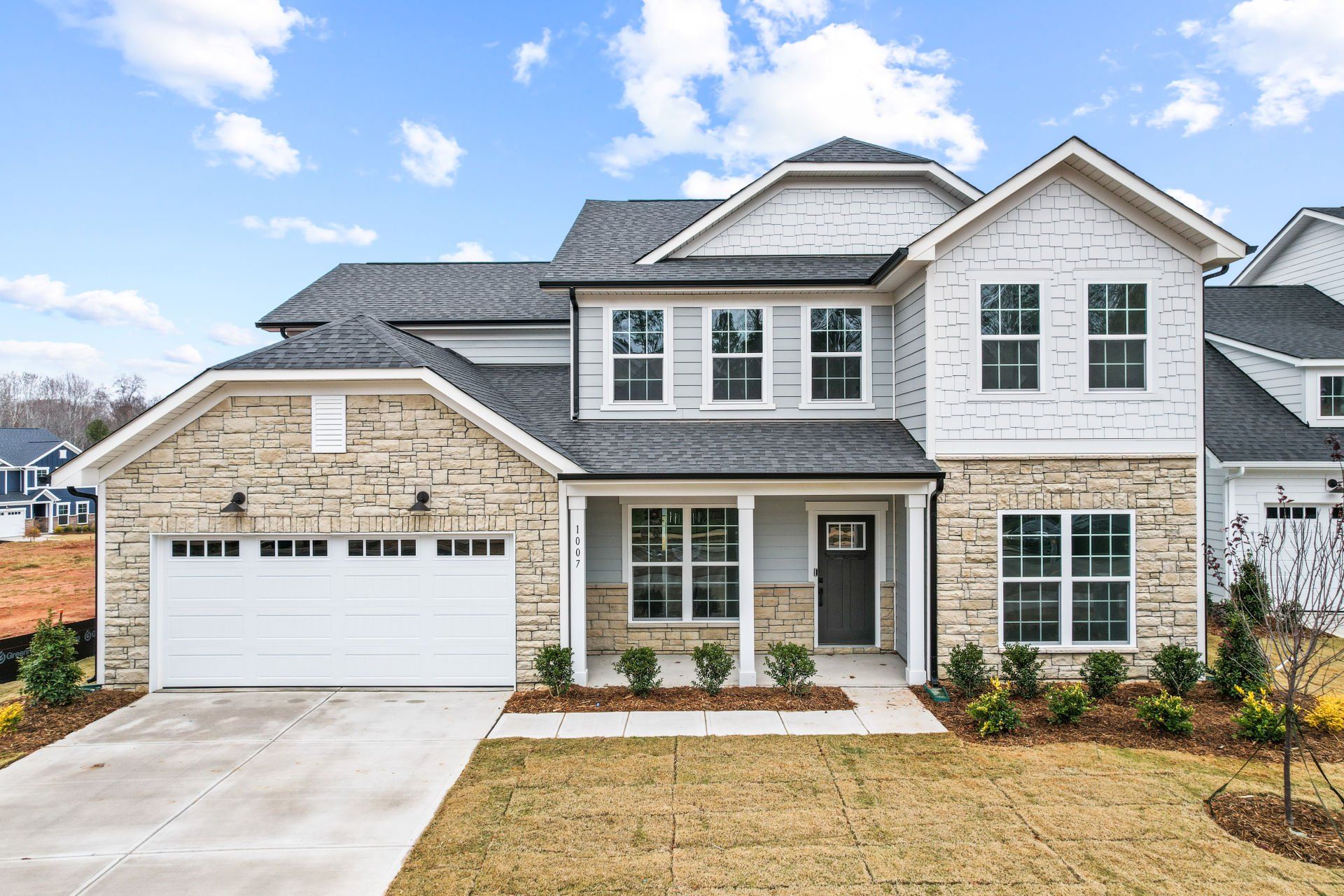 Front exterior of a new home in Forest Creek, Waxhaw, NC, highlighting curb appeal (Image 1). Front exterior of a new home in Forest Creek, Waxhaw, NC, highlighting curb appeal (Image 1).