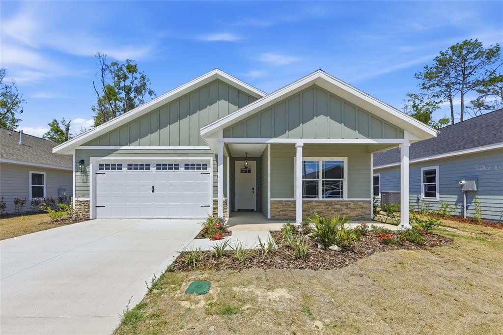 Front exterior of a new home in Grand Oaks, Gainesville, FL, highlighting curb appeal (Image 1). Front exterior of a new home in Grand Oaks, Gainesville, FL, highlighting curb appeal (Image 1).